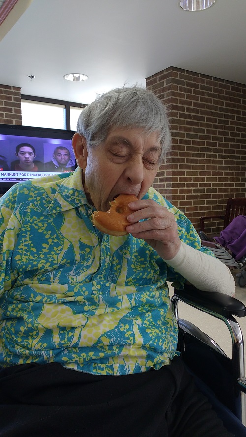 Dad Jan 28 2016 eating donut with eyes closed